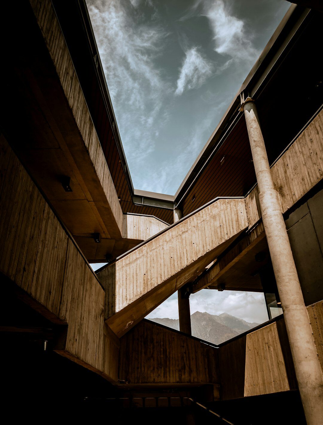 Interior stairwell of an abandoned concrete building in Chile