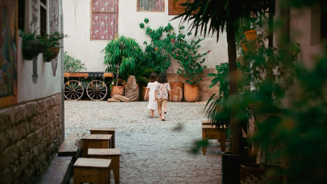 elderly woman in courtyard