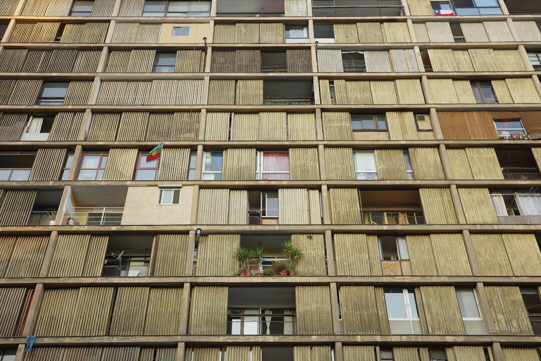 Facade of a neglected mid-century apartment building in Santiago