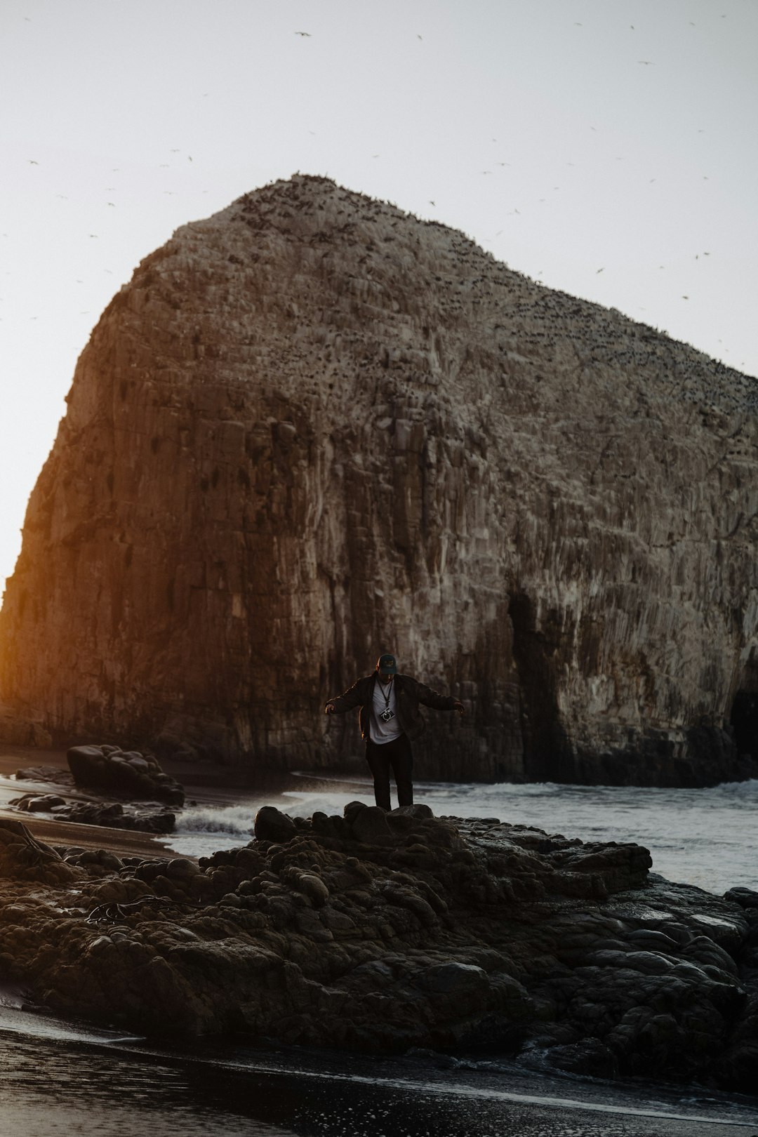 Portrait of a Chilean documentary photographer holding a camera